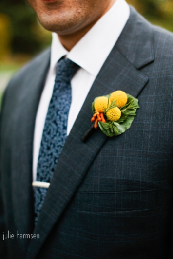 A craspedia and rosemary boutonniere, by Floressence.