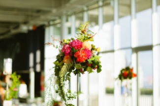 Ferns add drama to a very tall, colorful centerpiece at the OSP, by Floressence.