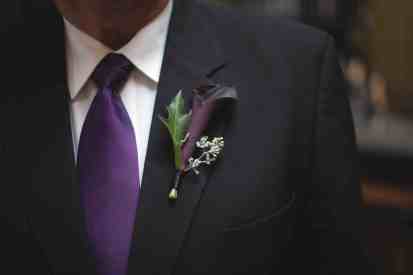 The groom's boutonniere is an eggplant mini-calla lily, by Floressence.