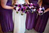 Dahlias, scabiosa, mini-calla lilies and hydrangea in shades of purple make up the hand-tied bouquets, by Floressence.